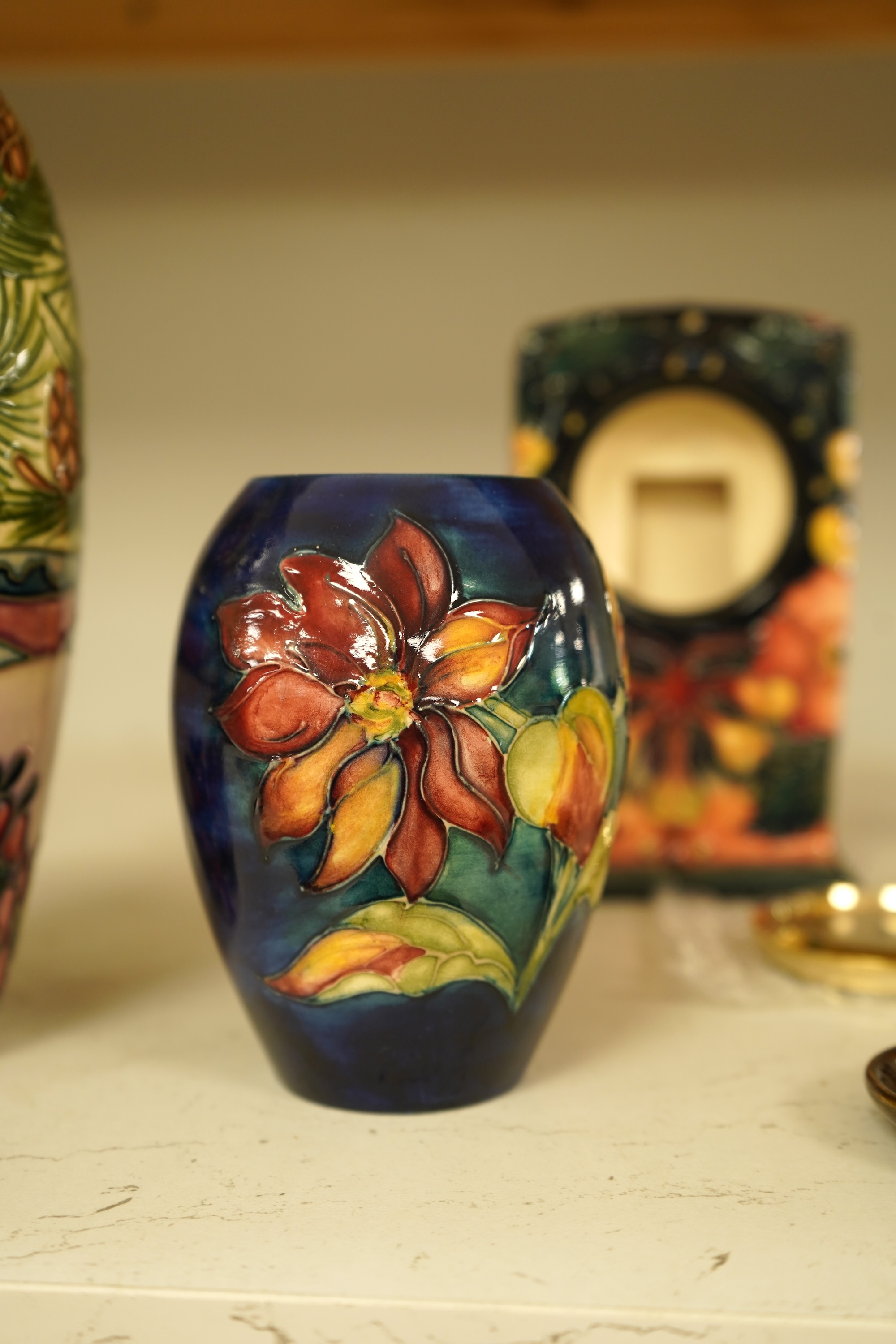 A collection of nine modern Moorcroft pieces including a Furzy Hill vase and a Toadstool vase, tallest 19cm